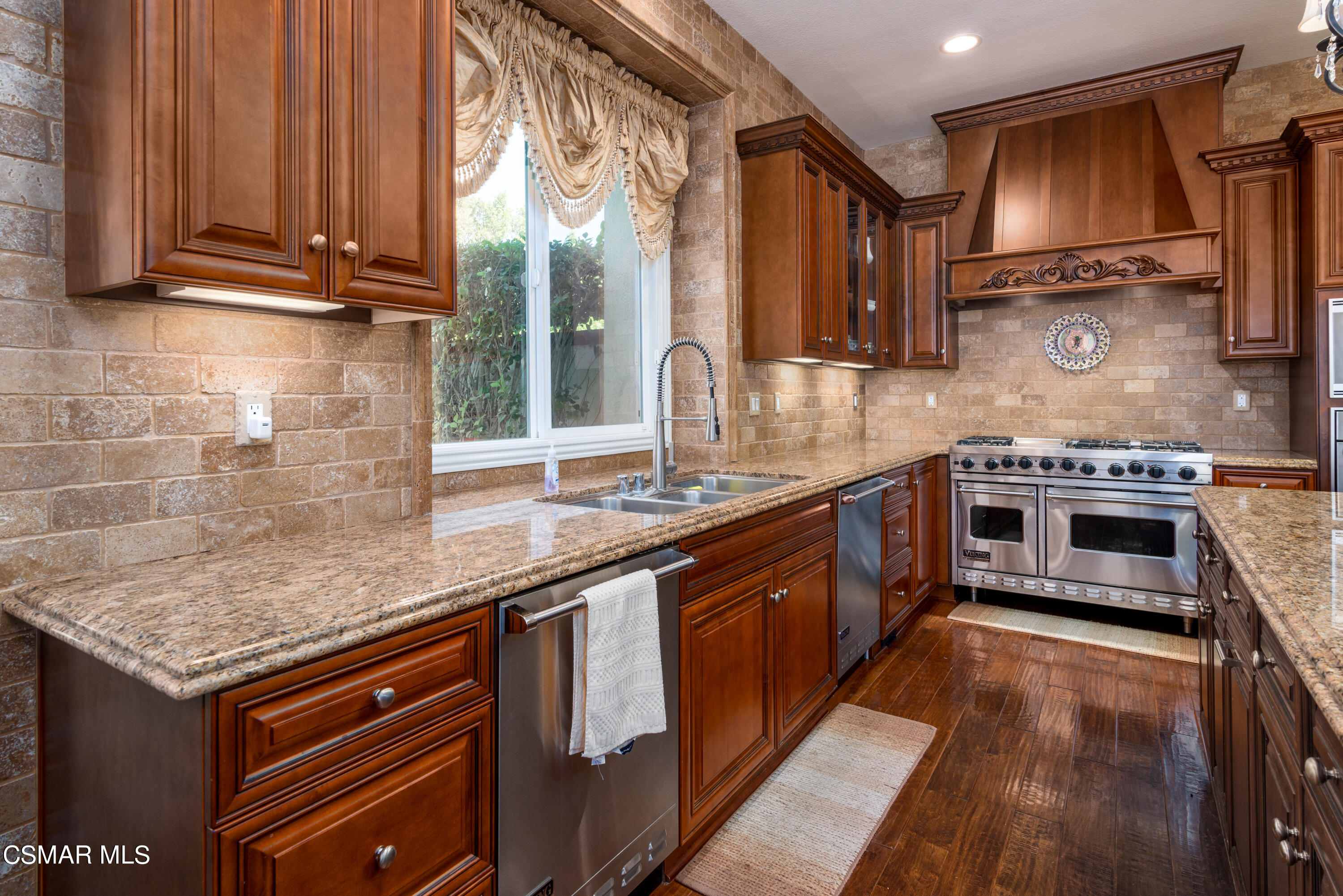 12442 Nelson Road Moorpark, CA 93021 - Photo 40 of 83 a kitchen with stainless steel appliances granite countertop a stove a sink and a microwave