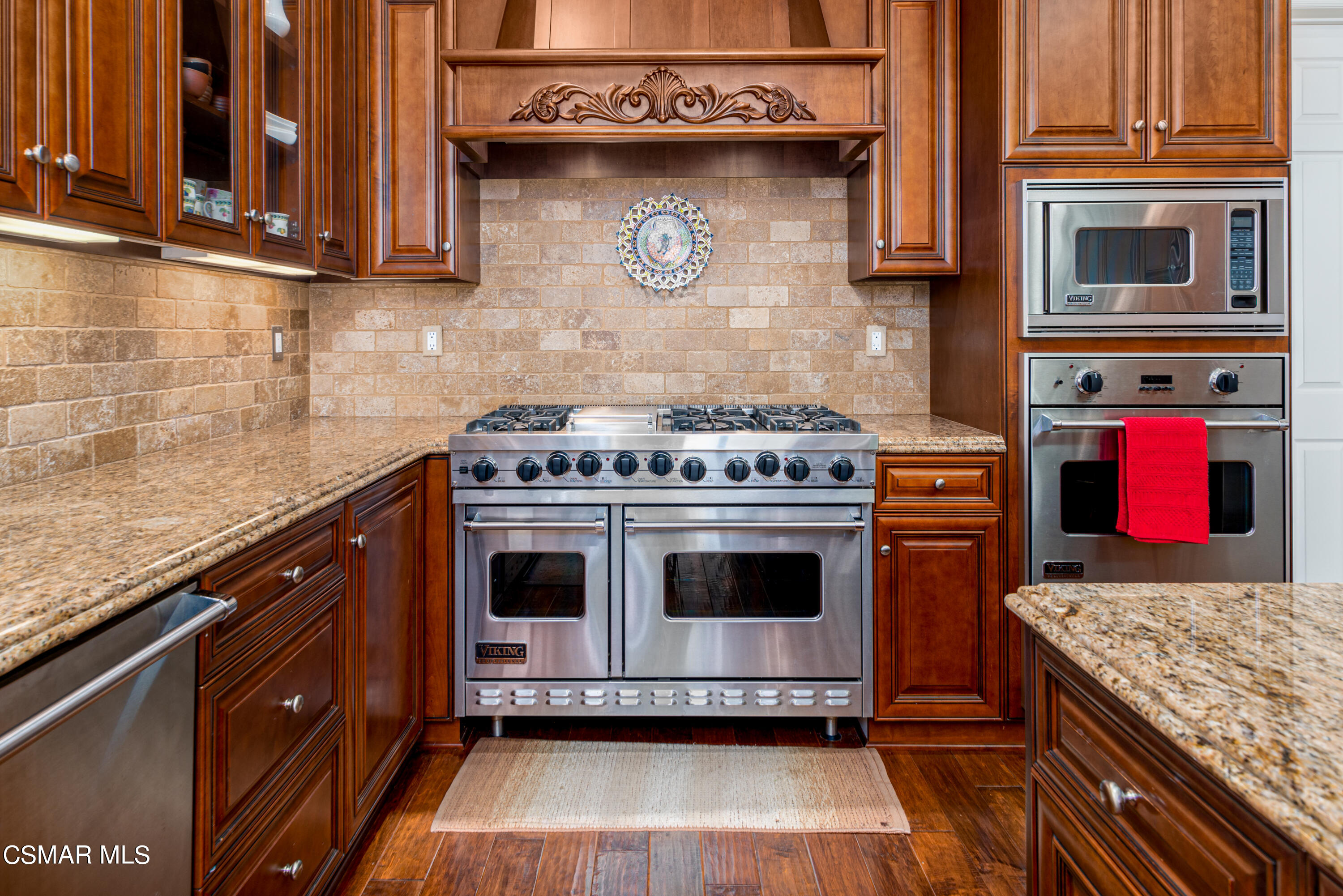 12442 Nelson Road Moorpark, CA 93021 - Photo 41 of 83 a kitchen with stainless steel appliances granite countertop a stove and a microwave