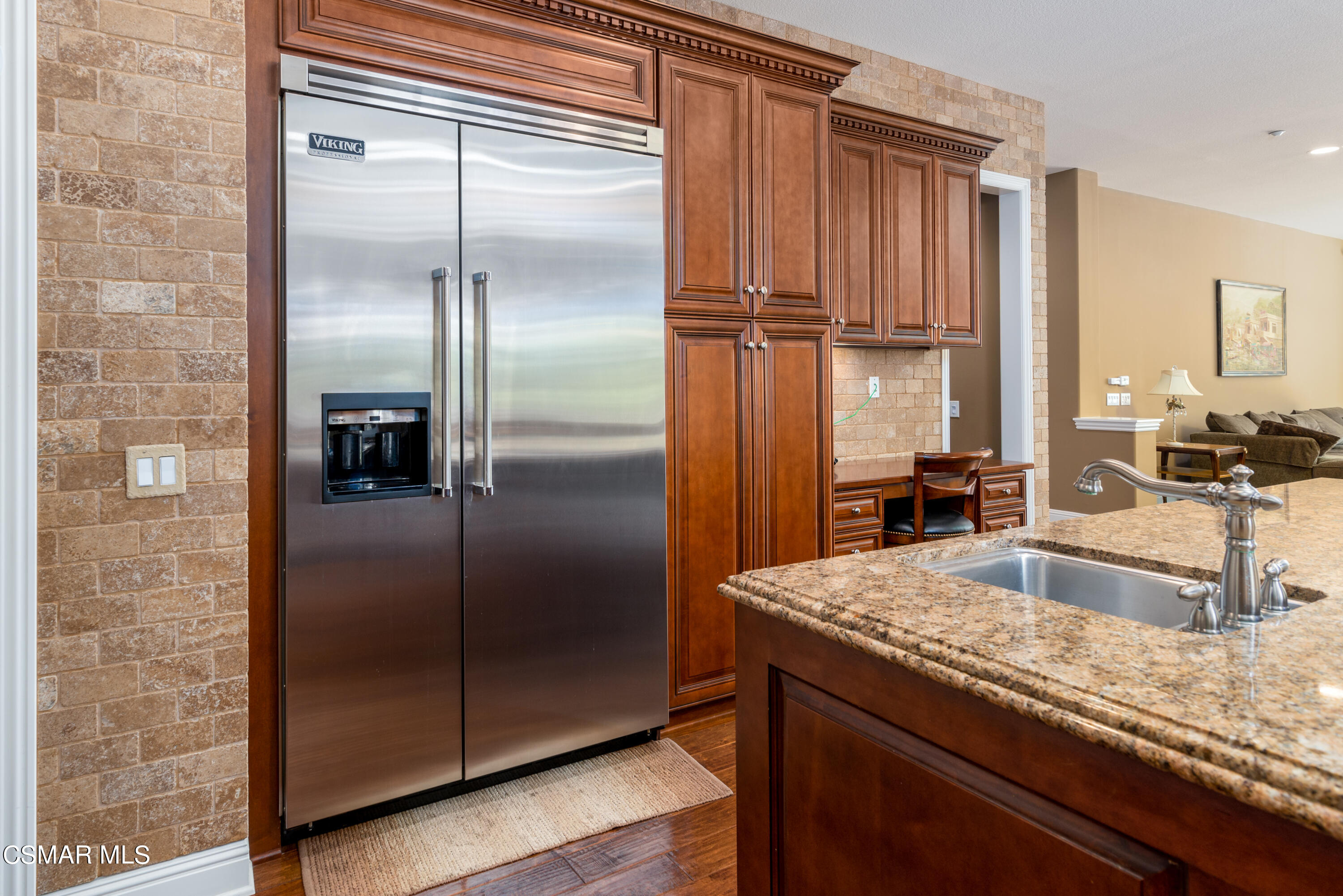 12442 Nelson Road Moorpark, CA 93021 - Photo 42 of 83 a kitchen with granite countertop a refrigerator and a sink