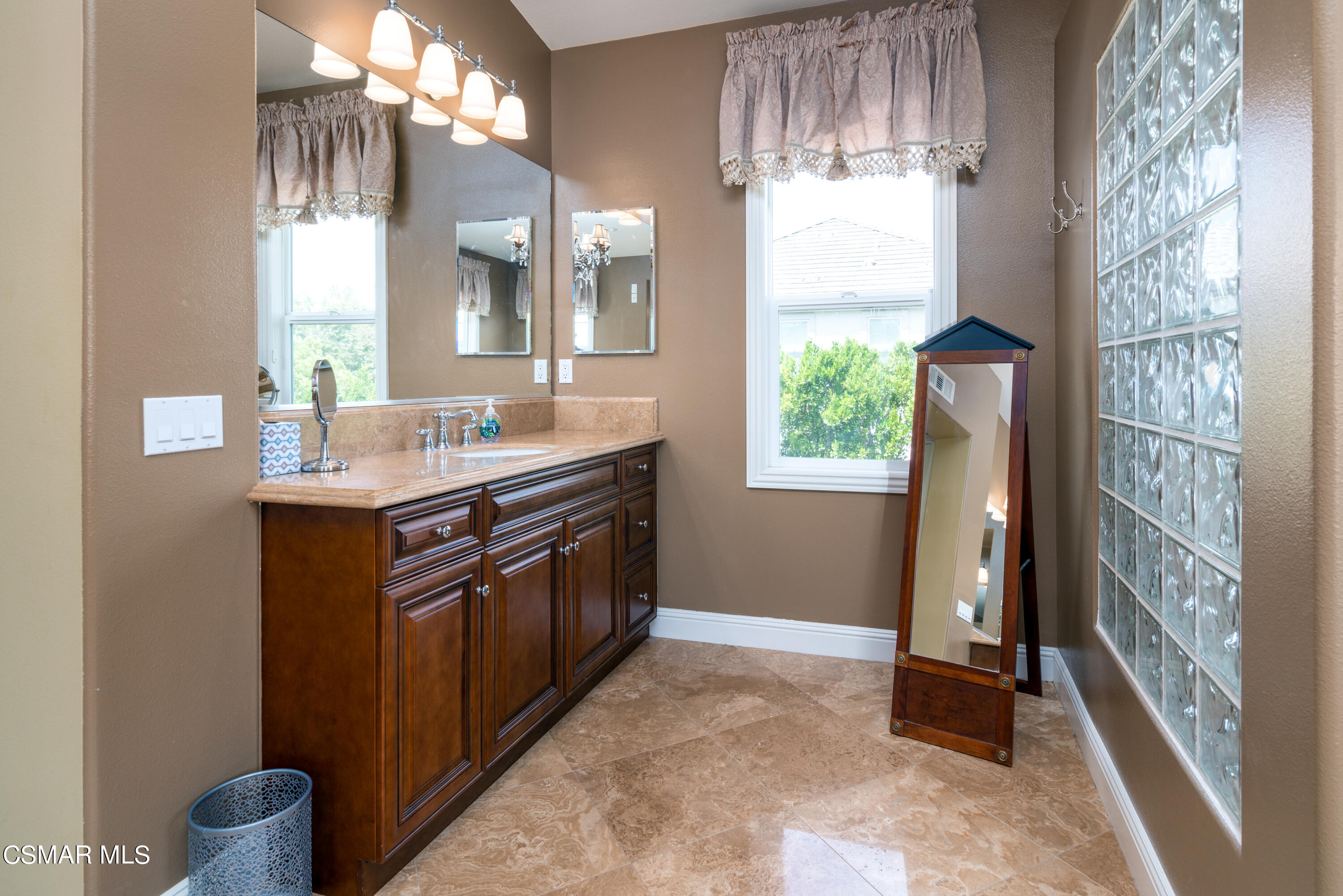 12442 Nelson Road Moorpark, CA 93021 - Photo 58 of 83 a bathroom with a sink and a mirror