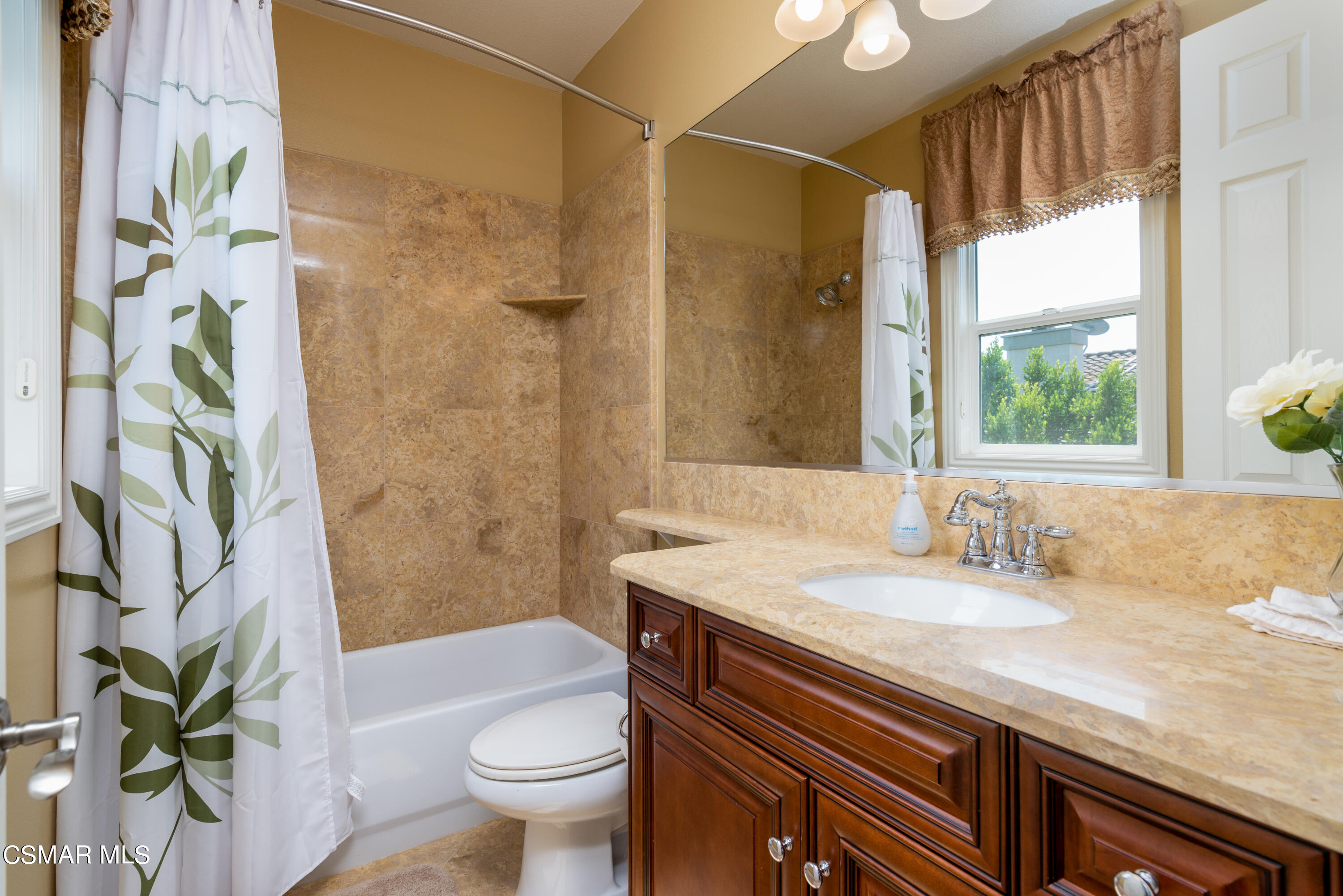 12442 Nelson Road Moorpark, CA 93021 - Photo 70 of 83 a bathroom with a granite countertop sink a toilet and shower