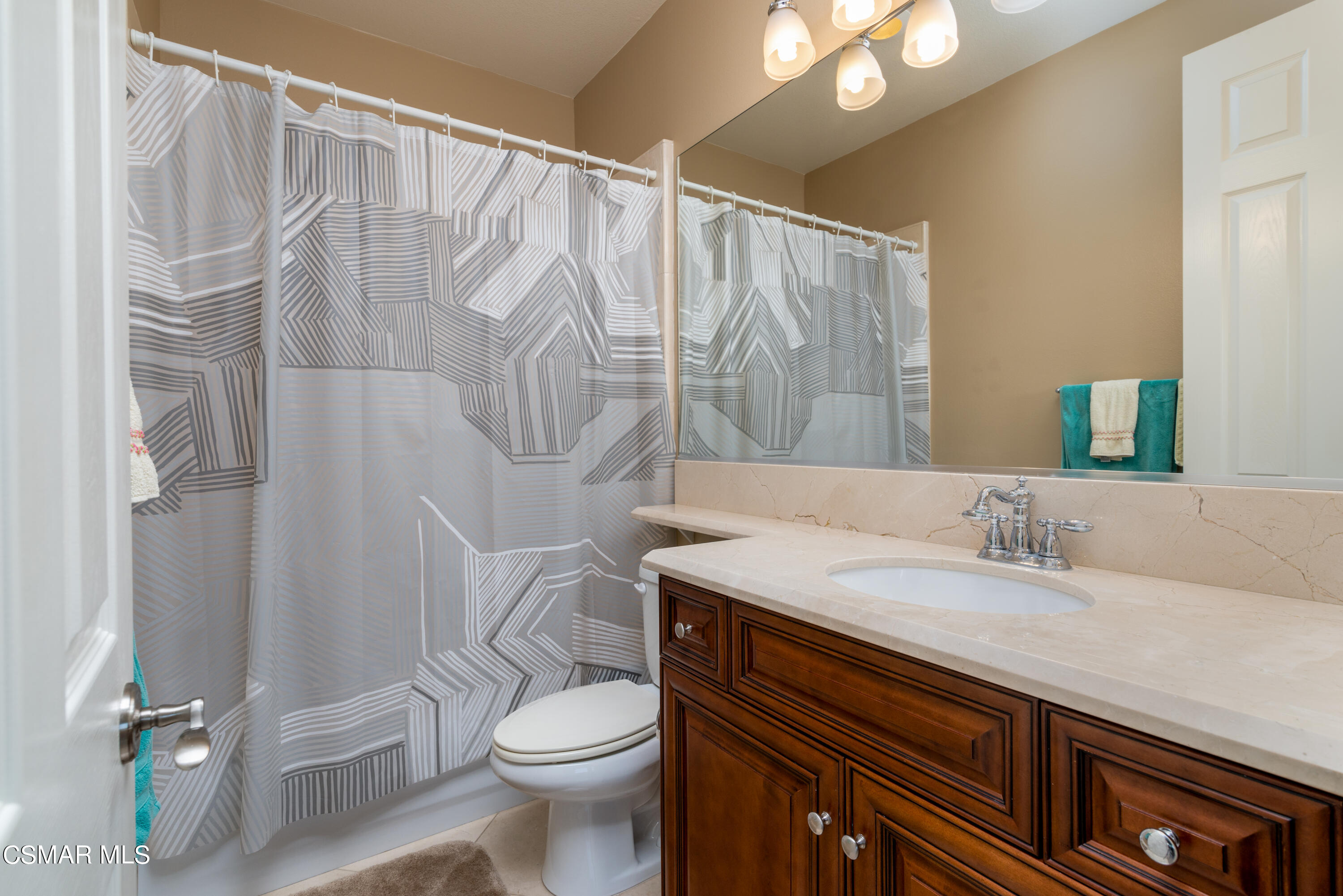 12442 Nelson Road Moorpark, CA 93021 - Photo 72 of 83 a bathroom with a granite countertop bathtub sink vanity mirror and toilet