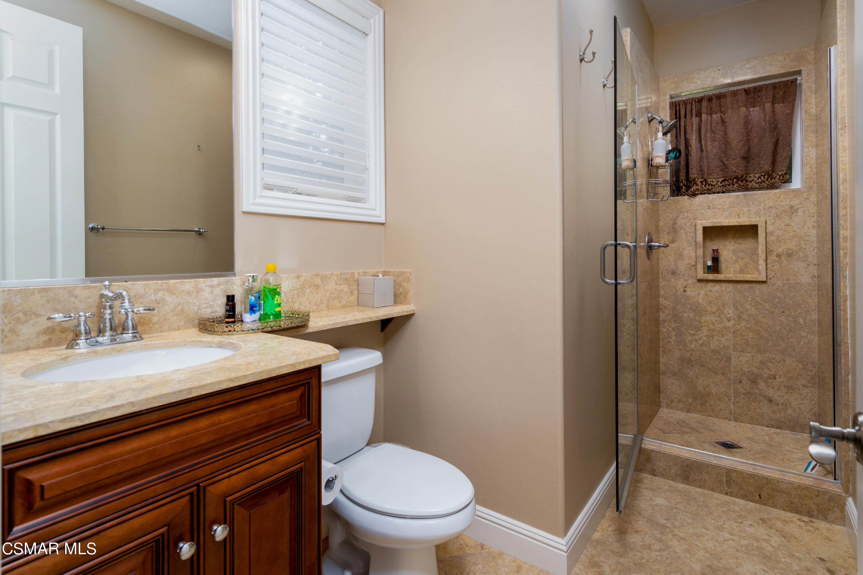 12442 Nelson Road Moorpark, CA 93021 - Photo 76 of 83 a bathroom with a granite countertop sink toilet and shower