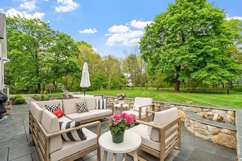 a view of yard with seating area and green space