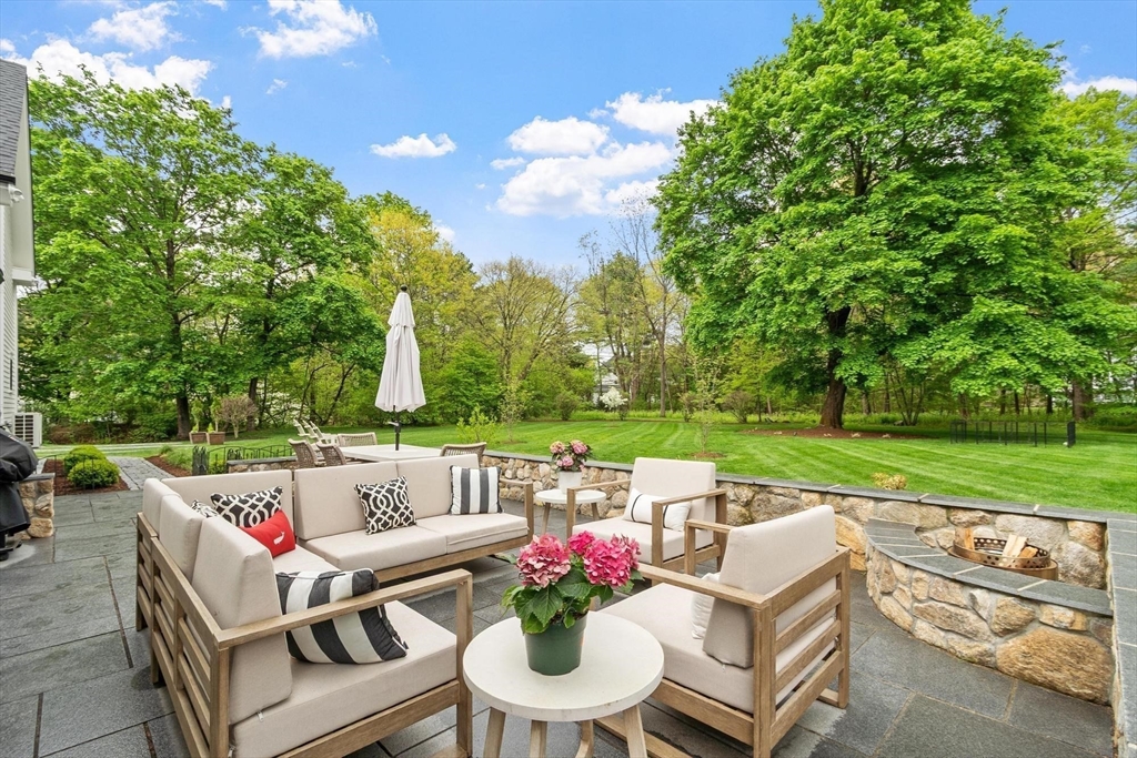 653 Main Street Concord, MA 01742 - Photo 2 of 42 a view of yard with seating area and green space