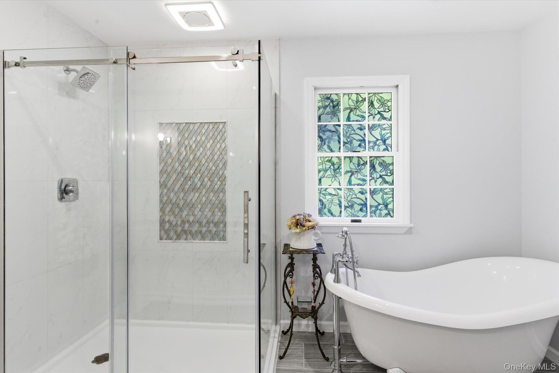 6 Brandy Road Cold Spring Harbor, NY 11724 - Photo 16 of 25 a bathroom with a white tub and shower
