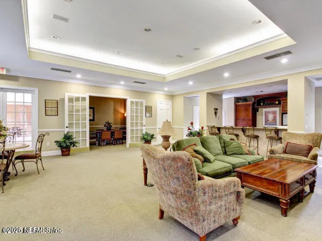 a living room with furniture and a gym