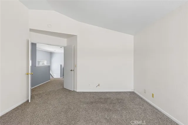 a spacious bathroom with double vanity and a mirror