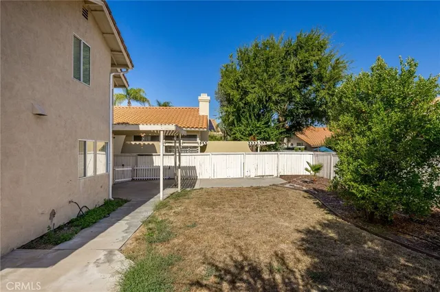 a view of a backyard of a house