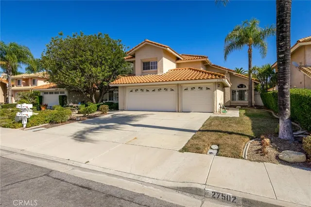 an empty room with wooden floor and a window