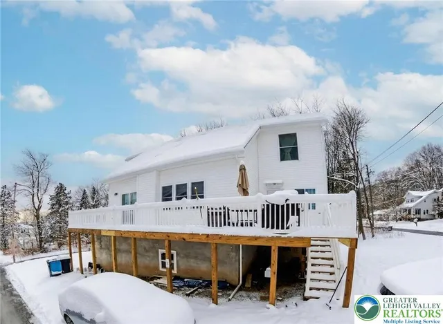 a balcony with furniture and a table