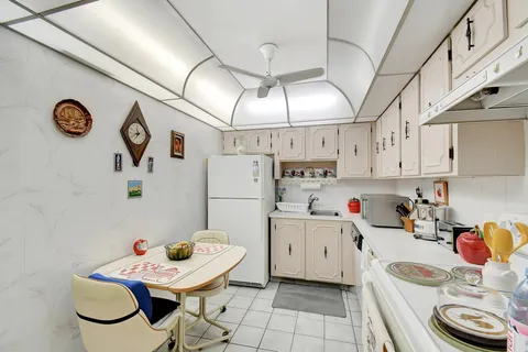 a living room with furniture a flat screen tv and a window