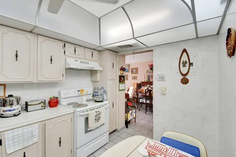 a living room with furniture and white walls