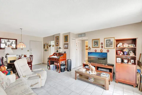 a bed room with a bed and a television