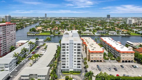 an aerial view of city and lake