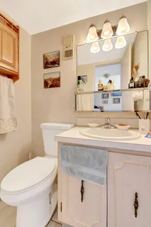 a room with a sink and a mirror