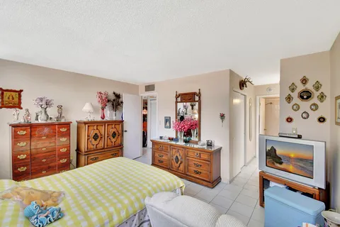 a view of house with backyard and porch