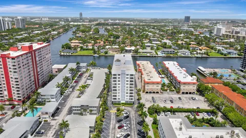 an aerial view of city and lake