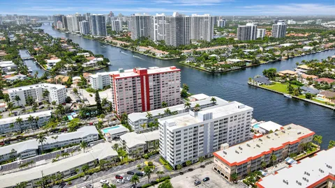 a view of city from balcony with furniture