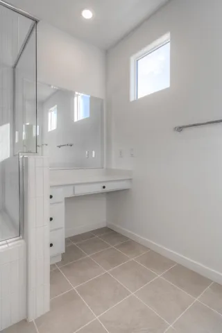 a room with a cabinets and a window