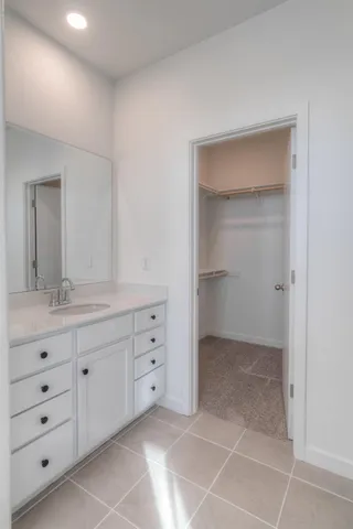 a bathroom with a double vanity sink and mirror