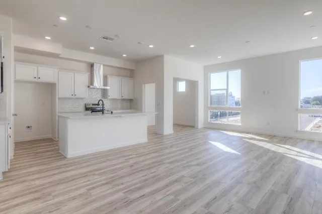 a view of kitchen with wooden floor and window