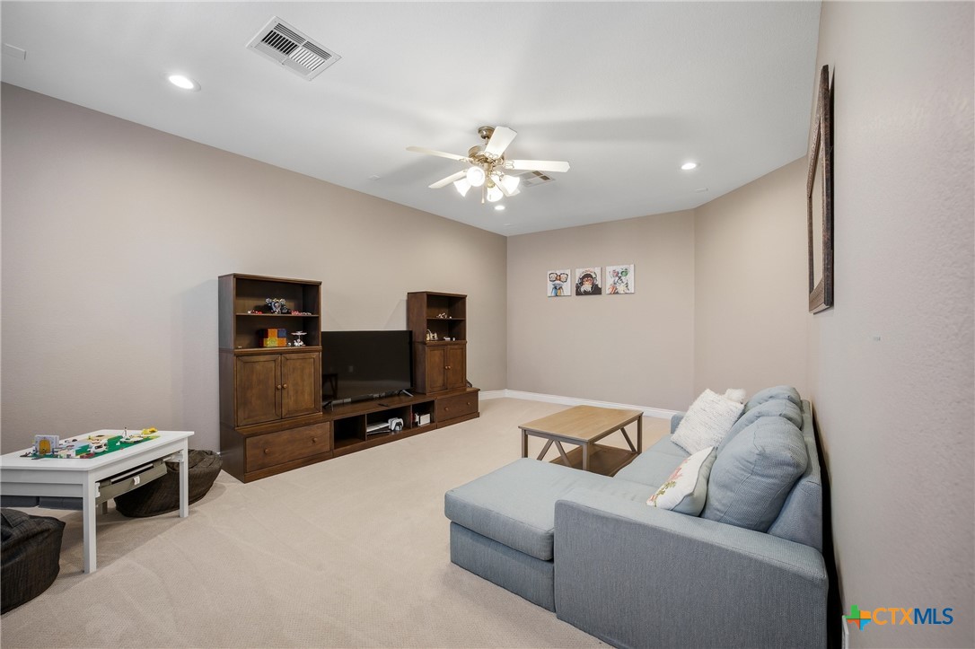 2427 Anderson Point Lane Spring, TX 77388 - Photo 28 of 47 a living room with furniture and a flat screen tv