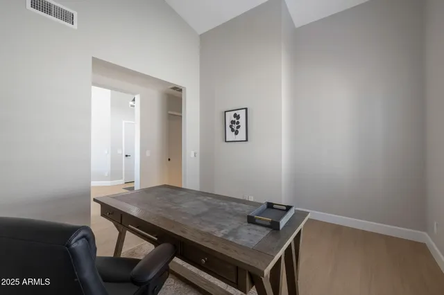 a view of a room with a table and chairs