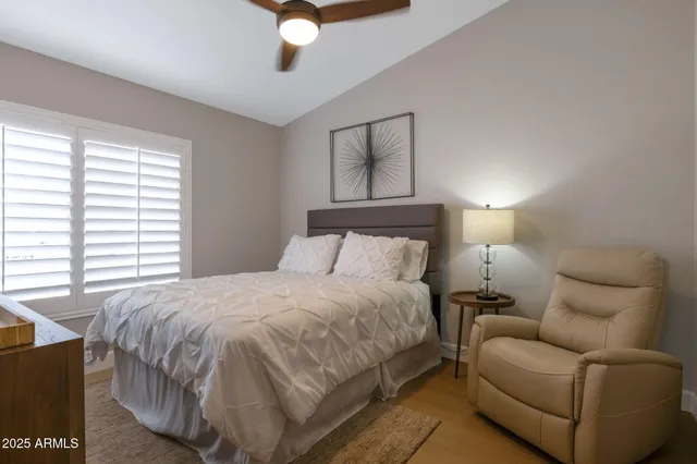 a bathroom with a sink toilet vanity and shower