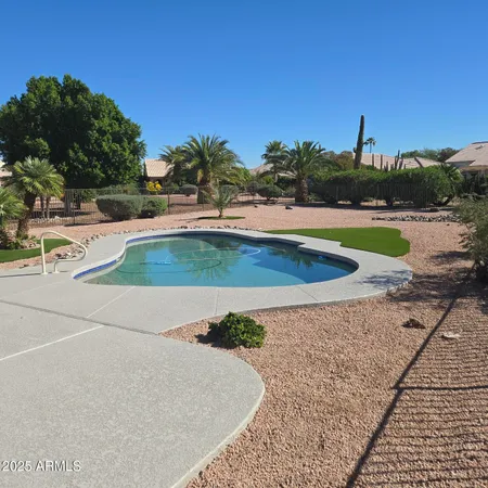 a view of a house with a backyard porch and sitting area