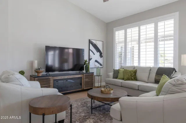 a living room with furniture and a large window