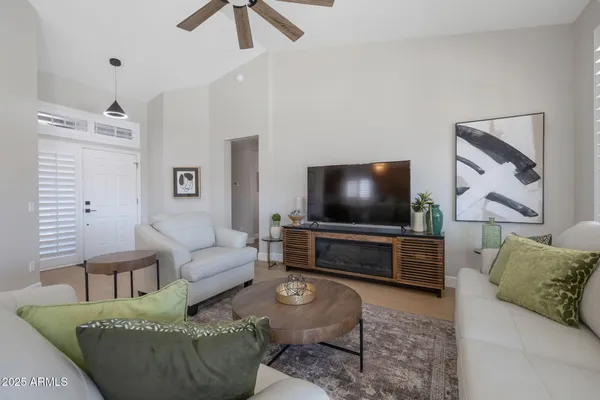a living room with furniture and a flat screen tv