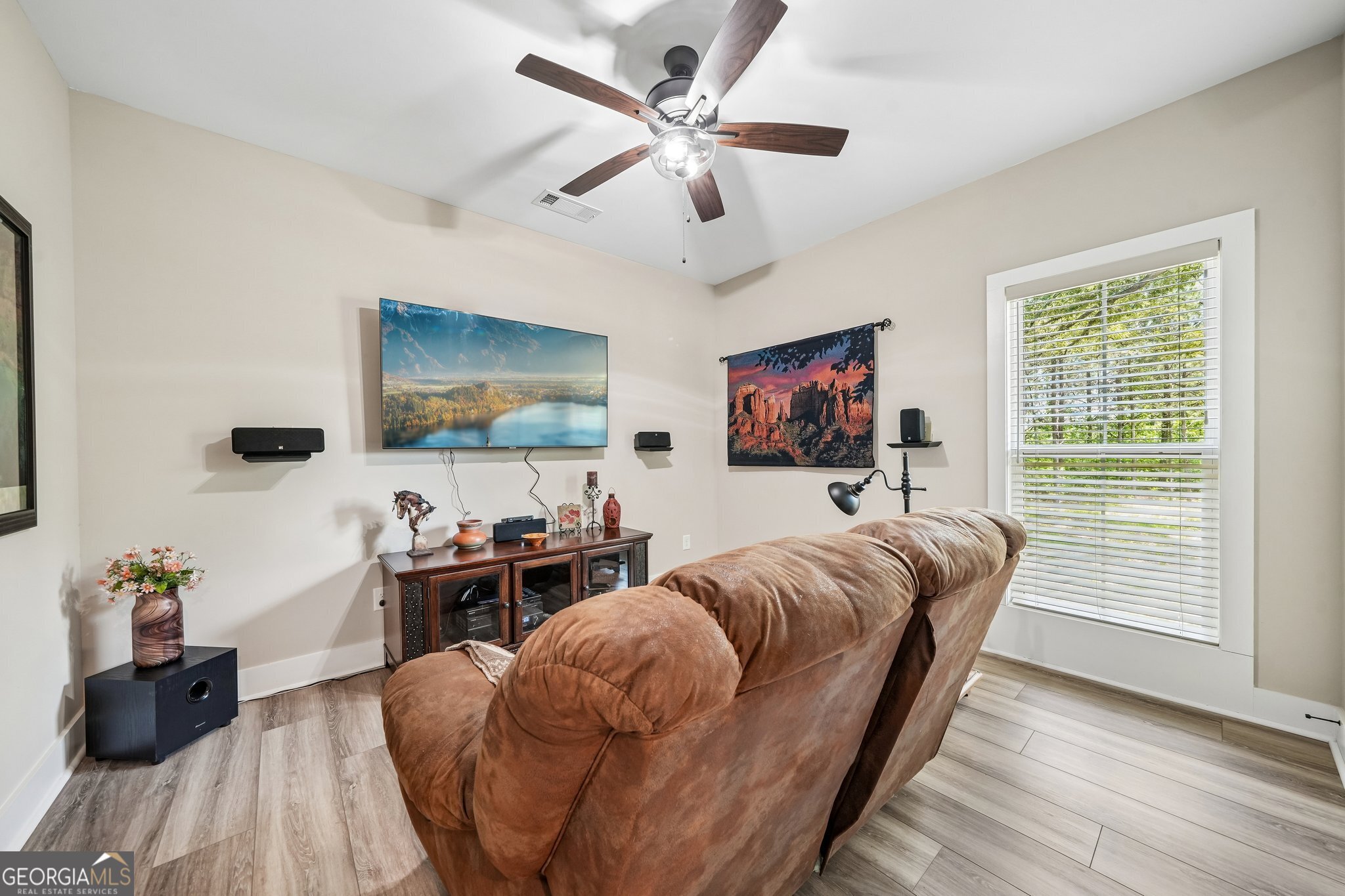 108 Wilderness Way Jackson, GA 30233 - Photo 18 of 31 a living room with furniture and a flat screen tv