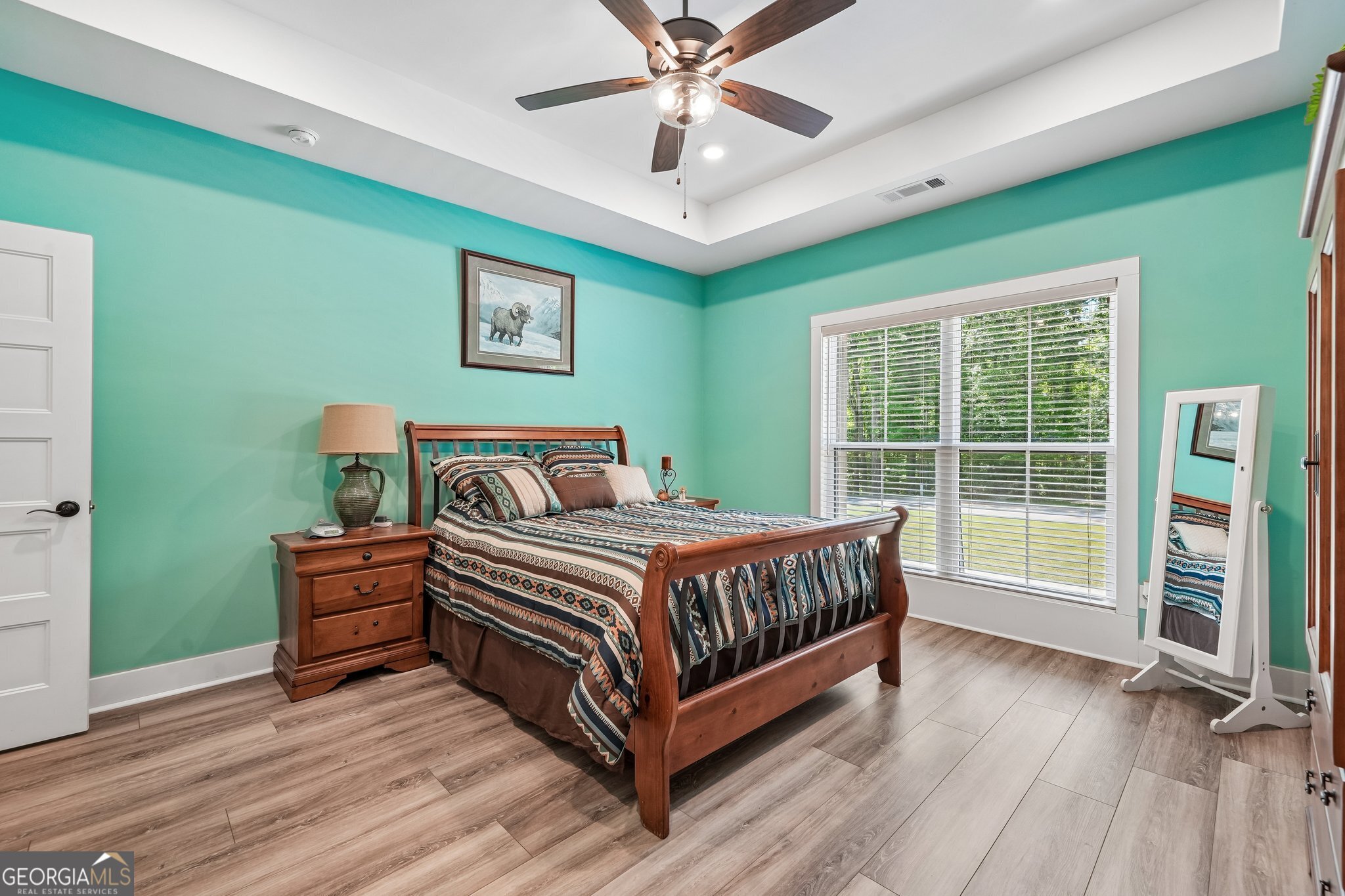 108 Wilderness Way Jackson, GA 30233 - Photo 20 of 31 a bedroom with a bed and a large window with wooden floor