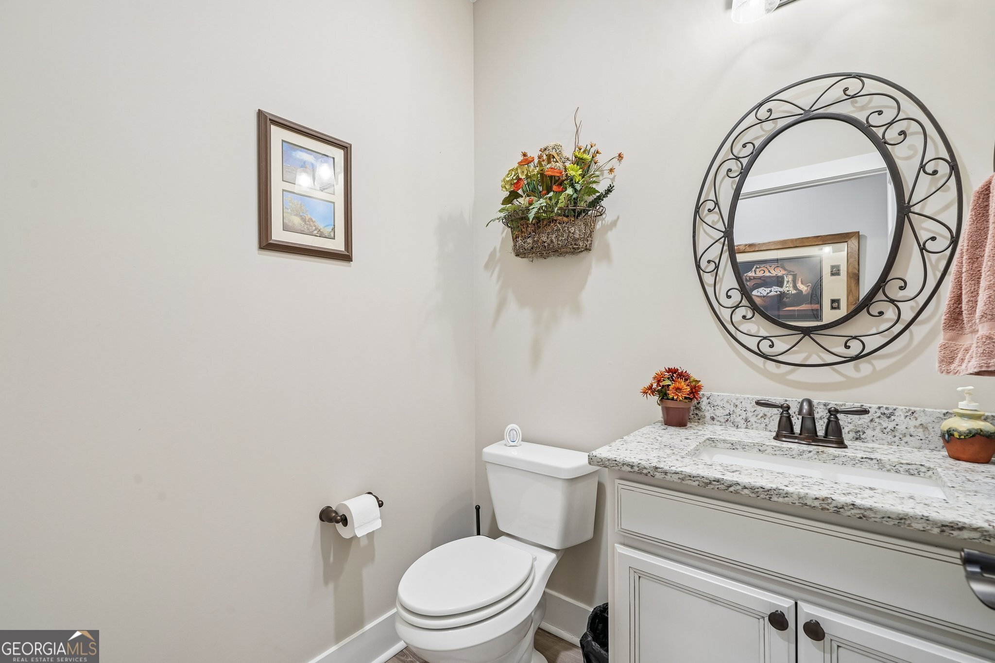 108 Wilderness Way Jackson, GA 30233 - Photo 22 of 31 a bathroom with a toilet a sink and a mirror