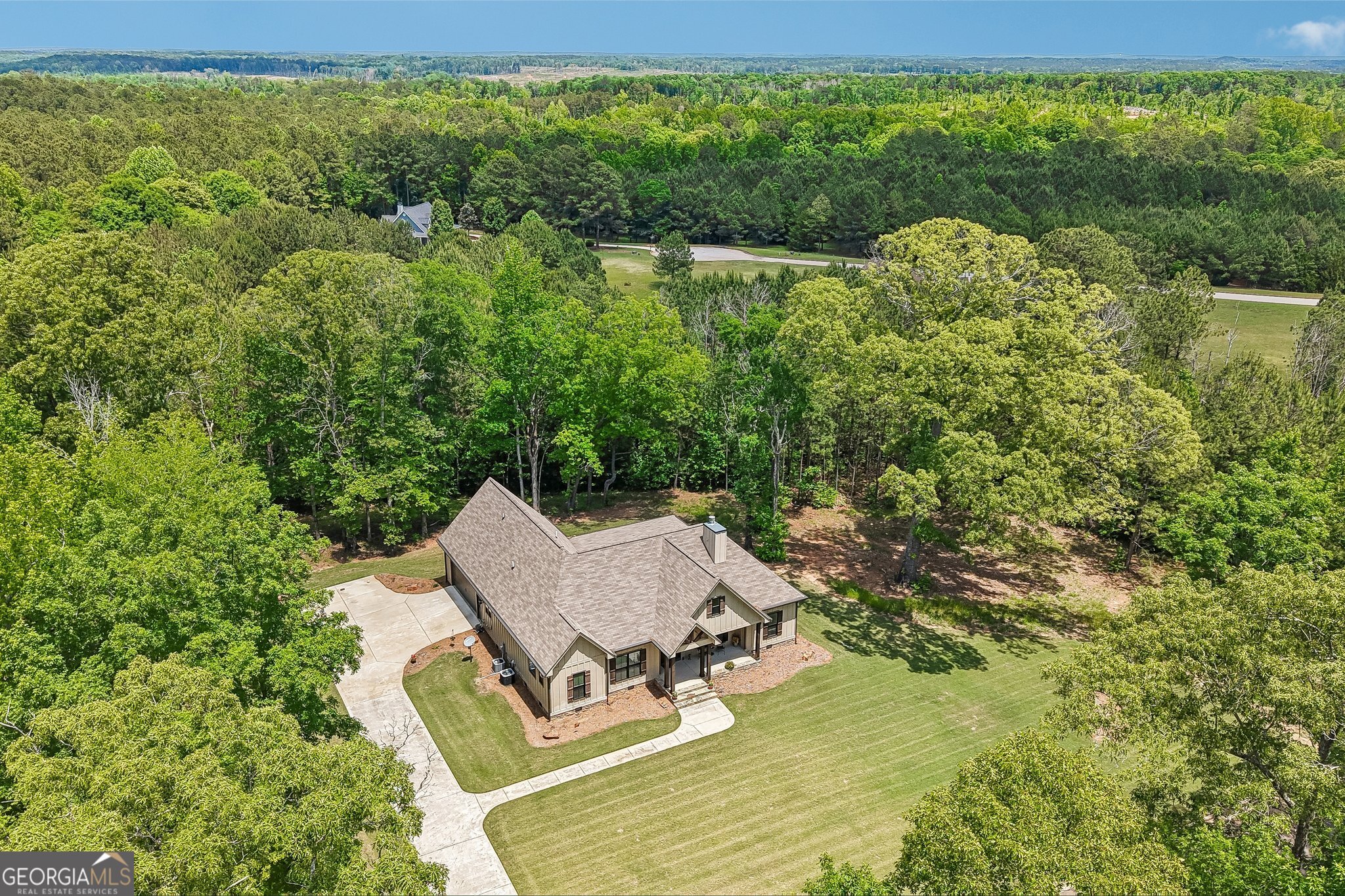 108 Wilderness Way Jackson, GA 30233 - Photo 26 of 31 a view of a swimming pool with lawn chairs under an umbrella