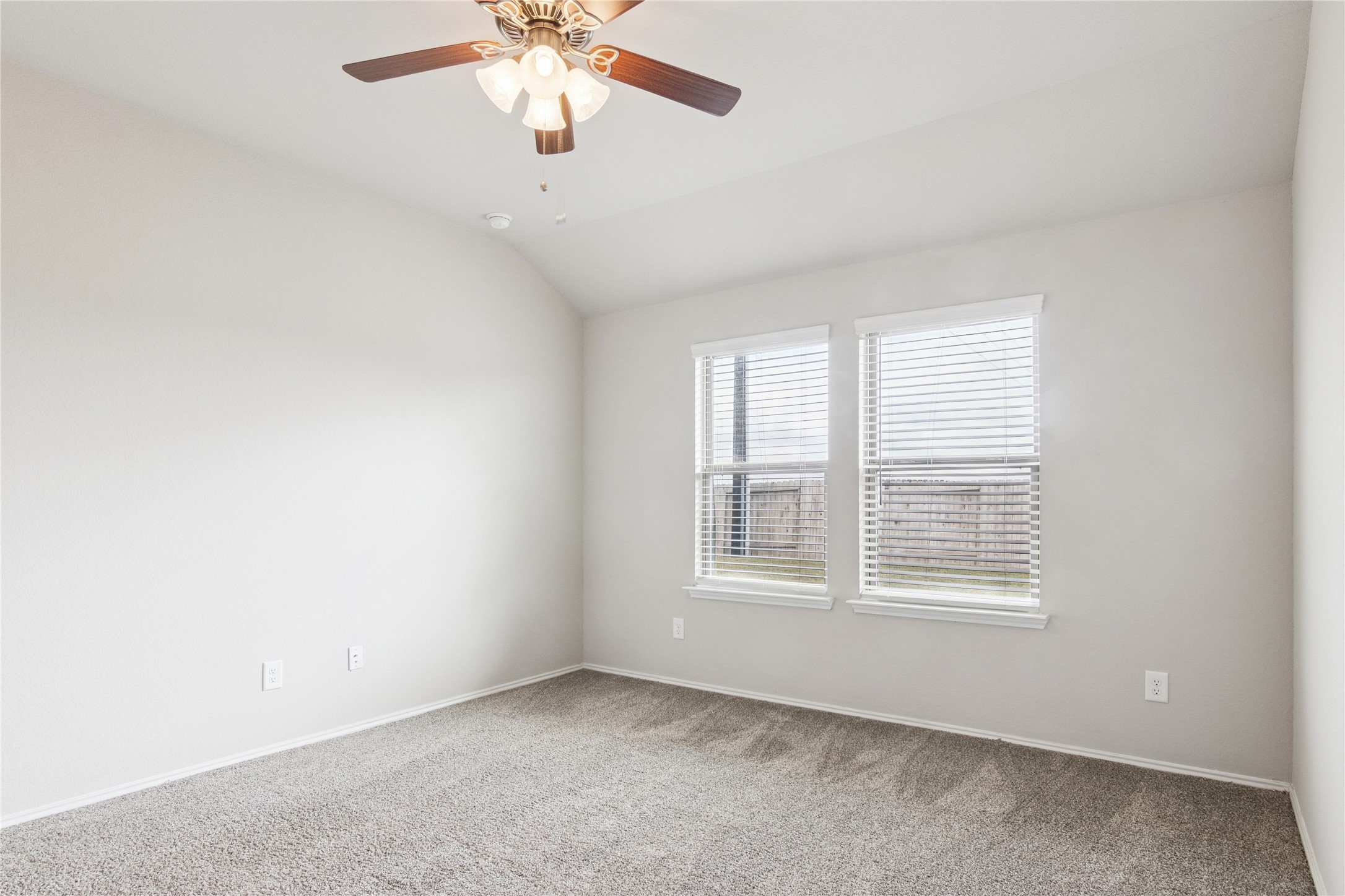 1603 Goose Island Lane Rosenberg, TX 77469 - Photo 14 of 26 an empty room with windows and fan