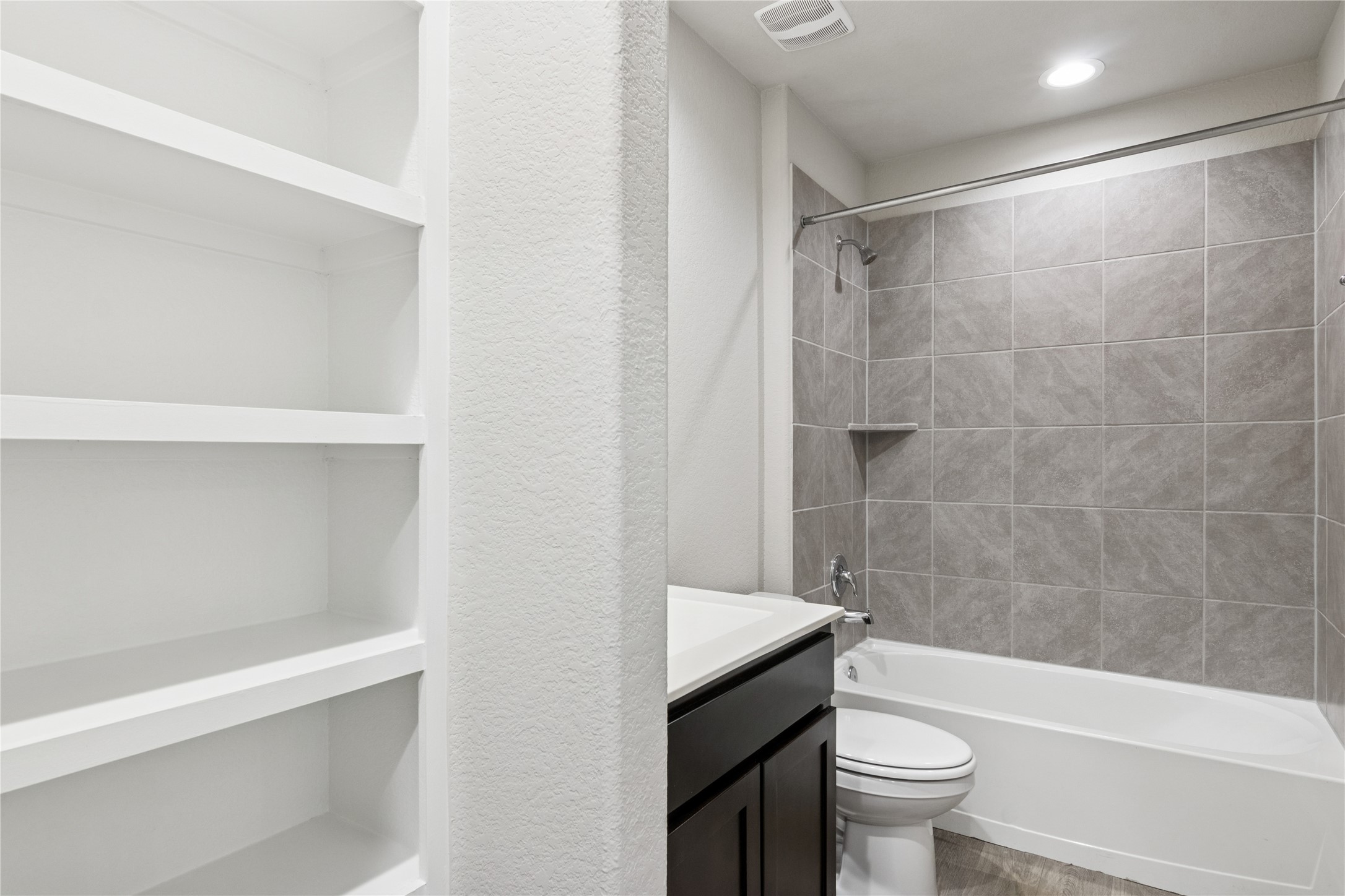 1603 Goose Island Lane Rosenberg, TX 77469 - Photo 19 of 26 a bathroom with a sink a toilet a bathtub and shower