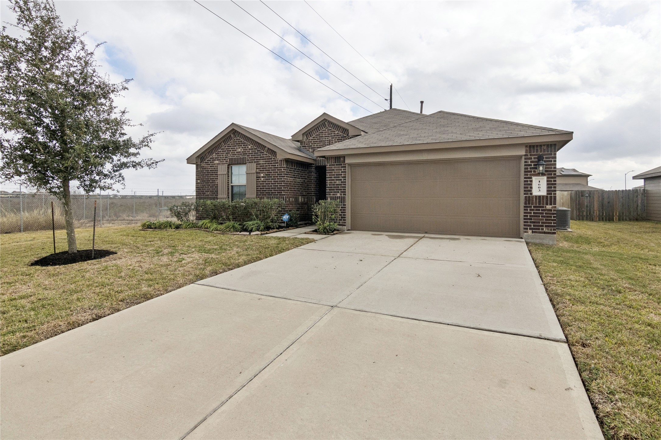 1603 Goose Island Lane Rosenberg, TX 77469 - Photo 2 of 26 a front view of a house with a yard