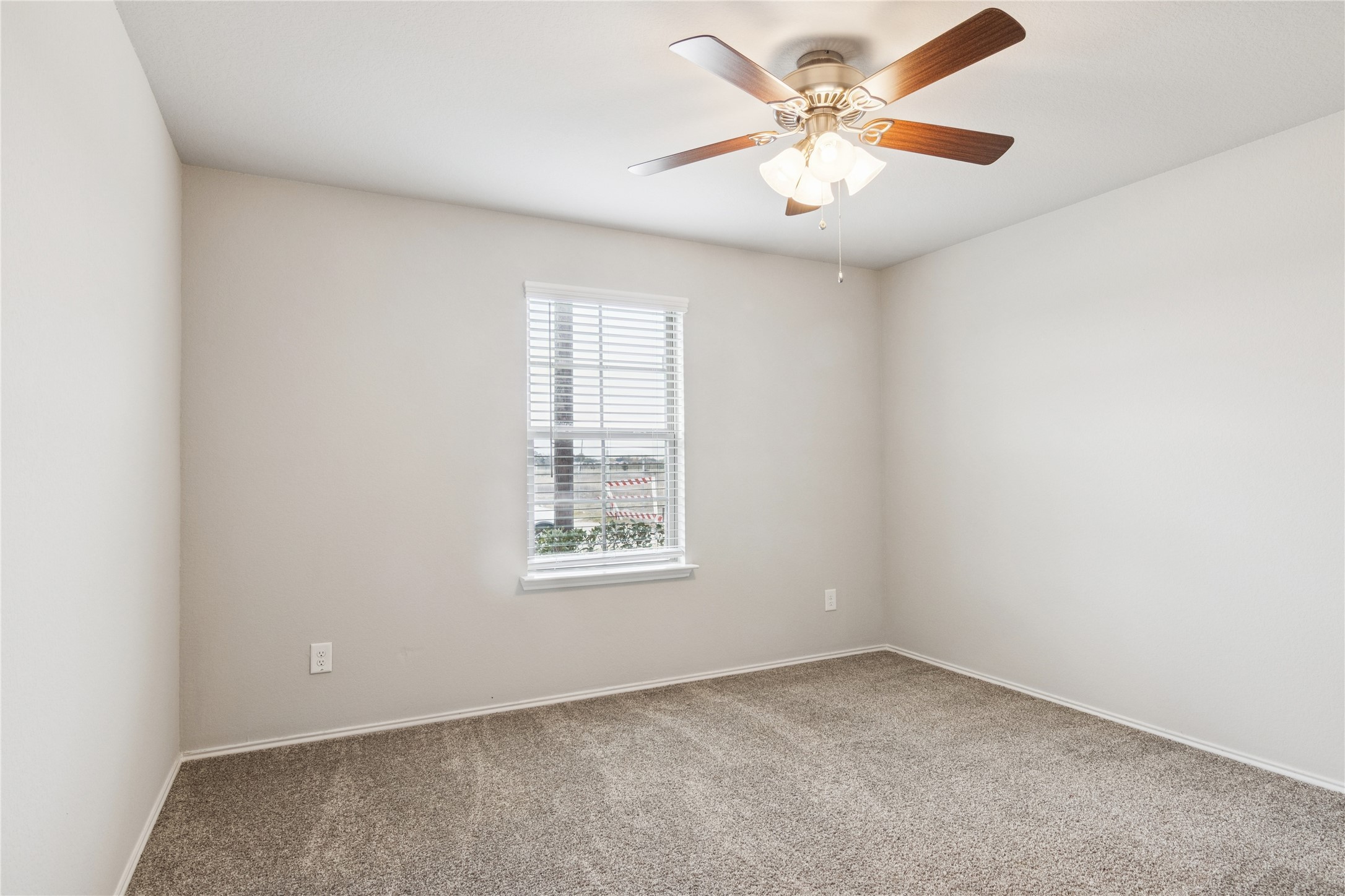 1603 Goose Island Lane Rosenberg, TX 77469 - Photo 23 of 26 an empty room with windows and fan