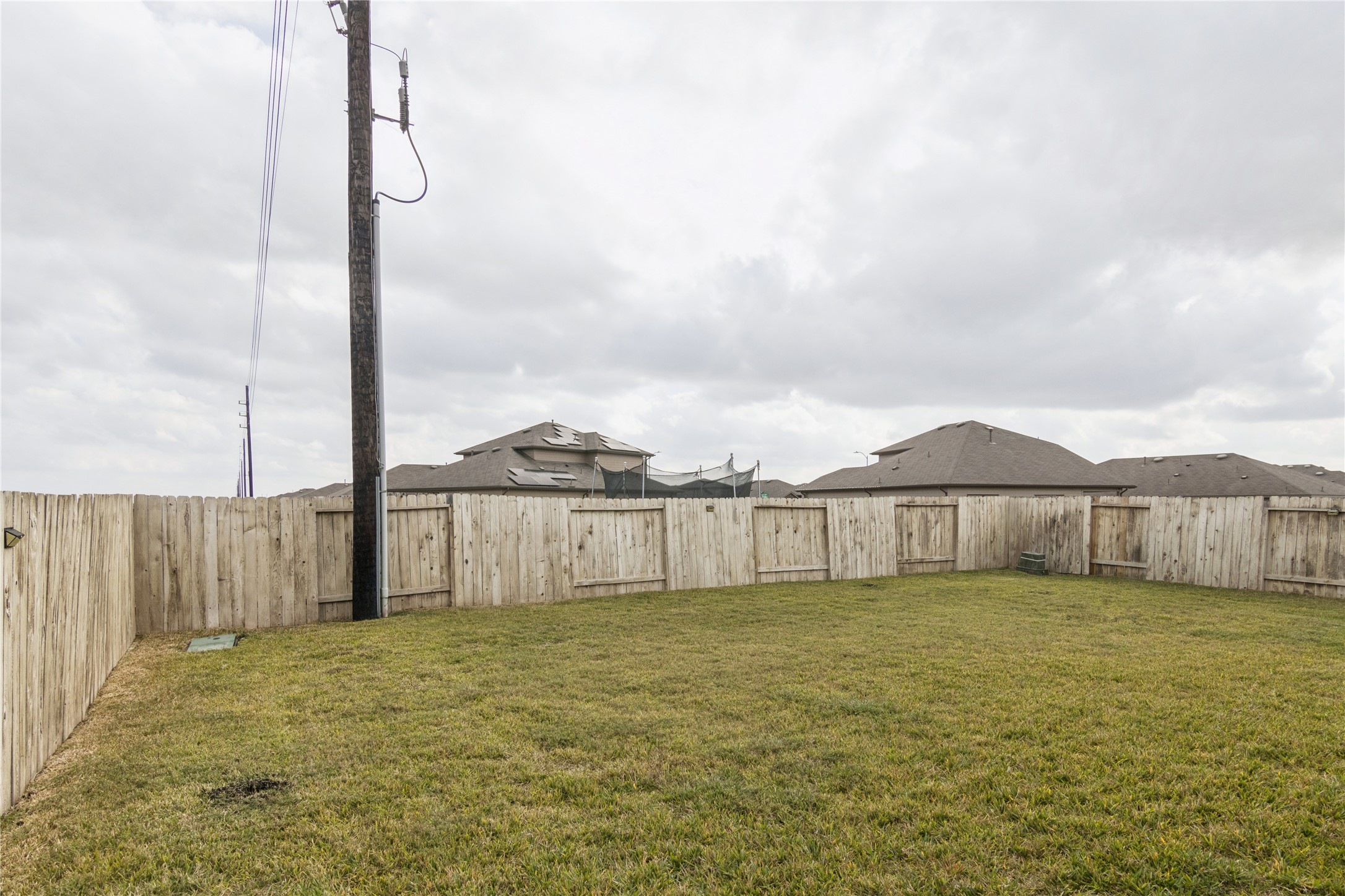 1603 Goose Island Lane Rosenberg, TX 77469 - Photo 24 of 26 a view of a yard with wooden fence