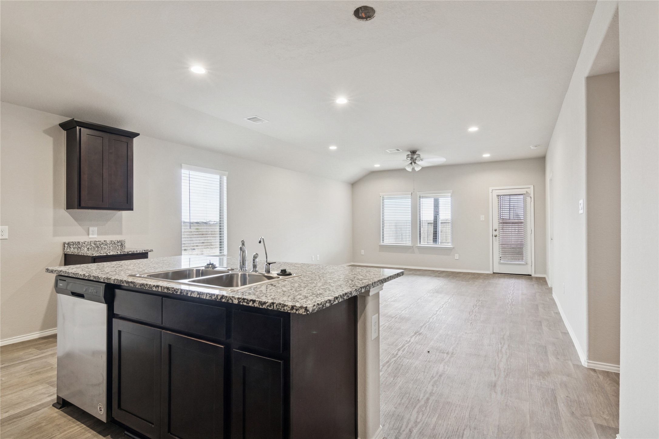 1603 Goose Island Lane Rosenberg, TX 77469 - Photo 6 of 26 a kitchen with granite countertop a sink and cabinets