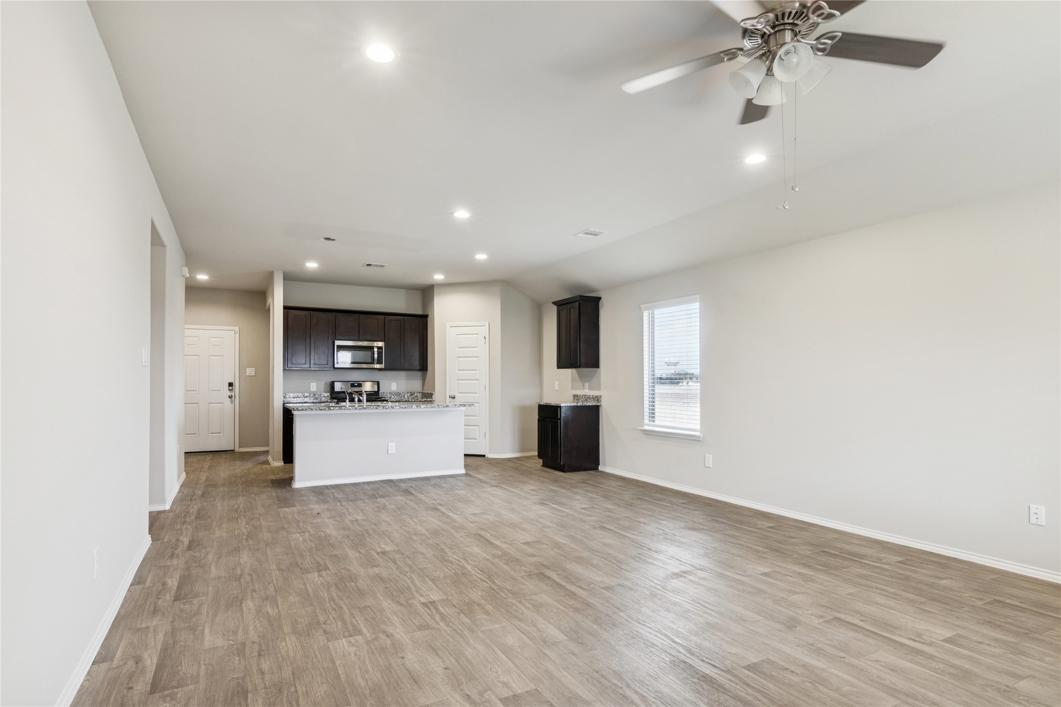 1603 Goose Island Lane Rosenberg, TX 77469 - Photo 8 of 26 a view of a kitchen with a sink and a stove top oven