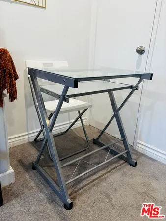 a kitchen view of a refrigerator stove and a sink