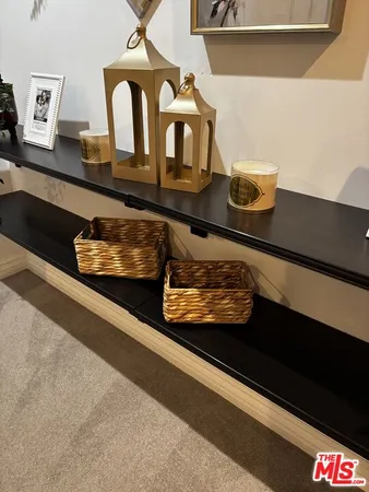 a table with a vase and flowers on it