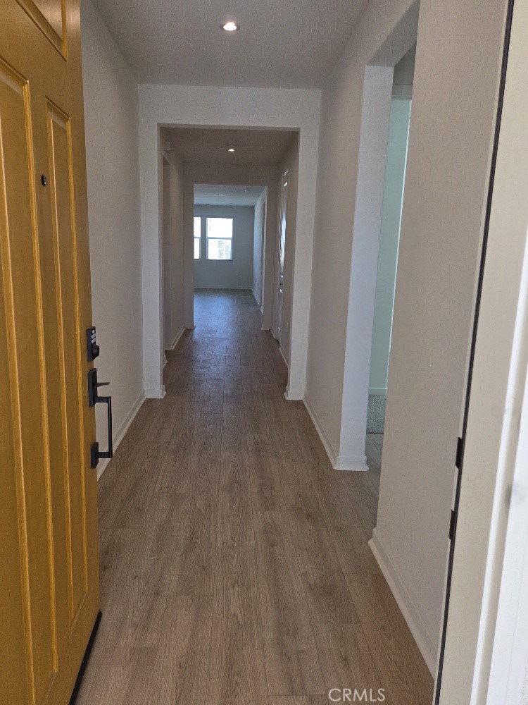73690 Raphael Drive Palm Desert, CA 92211 - Photo 2 of 14 a view of a hallway with wooden floor