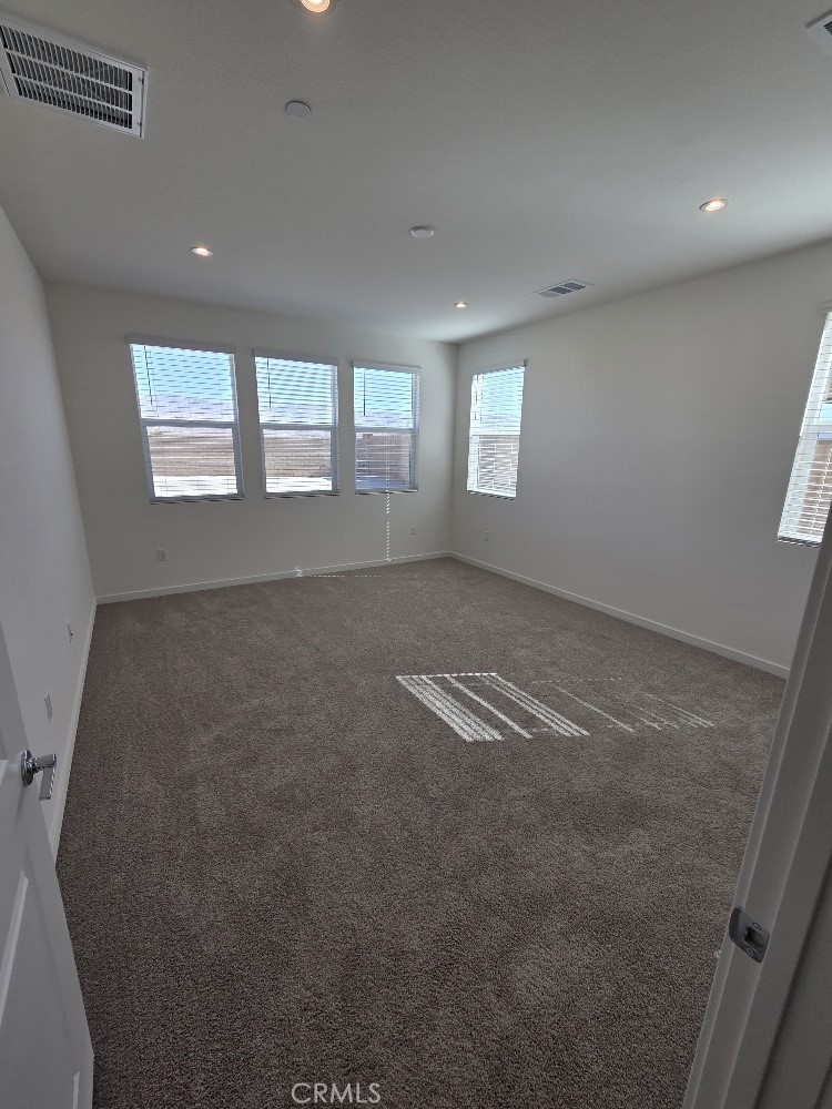 73690 Raphael Drive Palm Desert, CA 92211 - Photo 8 of 14 an empty room with windows