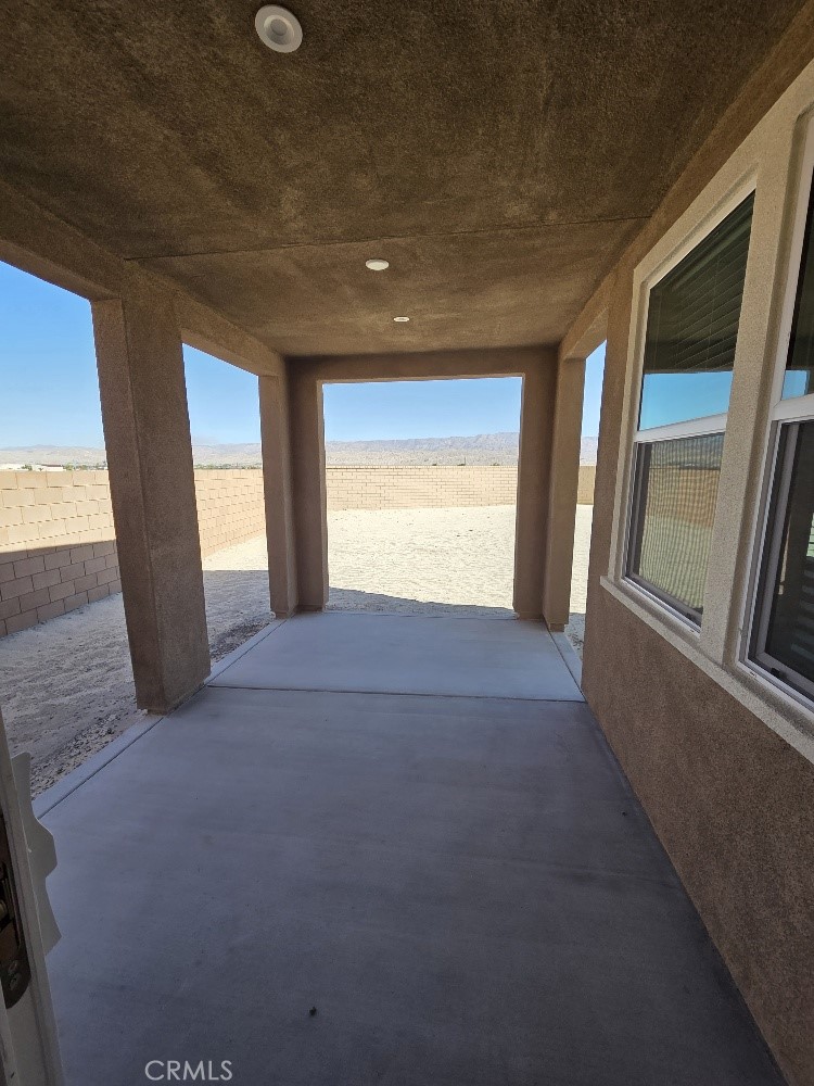 73690 Raphael Drive Palm Desert, CA 92211 - Photo 10 of 14 a view of an empty room with a window