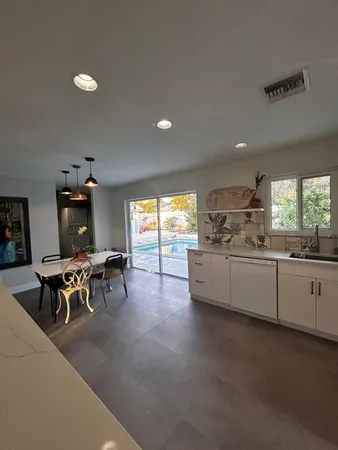 a view of a dining room with furniture window and outside view