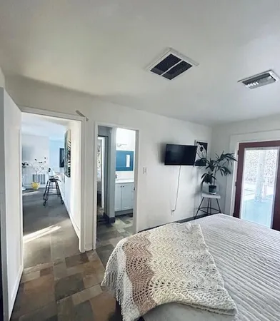 a bathroom with a double vanity sink toilet and bathtub